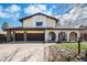 Charming two-story home featuring a two-car garage, front porch arches, and well-maintained landscaping at 1482 S Lansing St, Aurora, CO 80012