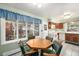 Eat-in kitchen featuring natural light, tile floors, and neutral walls at 1482 S Lansing St, Aurora, CO 80012