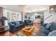 Bright living room with hardwood floors, vaulted ceiling, and large windows for natural light at 1482 S Lansing St, Aurora, CO 80012