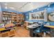 Spacious home office features a large window, a wooden floor, and built-in bookshelves at 1482 S Lansing St, Aurora, CO 80012