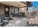 Covered patio with seating area and access to a backyard gazebo at 1482 S Lansing St, Aurora, CO 80012