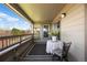 Inviting balcony featuring outdoor seating, a side table, and a charming outdoor rug at 12762 Ironstone Way # 302, Parker, CO 80134