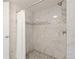 Modern bathroom featuring a tiled shower with glass door and elegant fixtures at 12762 Ironstone Way # 302, Parker, CO 80134