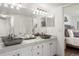 Bathroom with double sink vanity, modern vessel sinks, and stylish lighting at 12762 Ironstone Way # 302, Parker, CO 80134