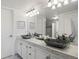 Bathroom showcasing marble countertop, unique decorative sinks, modern lighting and vanity at 12762 Ironstone Way # 302, Parker, CO 80134