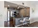 Modern kitchen featuring stainless steel appliances, sleek gray cabinetry, and a breakfast bar with seating for two at 12762 Ironstone Way # 302, Parker, CO 80134