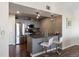 Modern kitchen with gray cabinetry, stainless steel appliances, and a breakfast bar with seating for two at 12762 Ironstone Way # 302, Parker, CO 80134