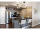 Charming kitchen with gray cabinetry, stainless steel appliances, and a breakfast bar at 12762 Ironstone Way # 302, Parker, CO 80134