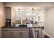 Open kitchen with a view to the living room and stainless steel appliances at 12762 Ironstone Way # 302, Parker, CO 80134