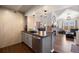 Open kitchen with a view to the living room and stainless steel appliances at 12762 Ironstone Way # 302, Parker, CO 80134