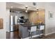 Well-appointed kitchen featuring stainless steel appliances, stylish gray cabinetry, and modern fixtures at 12762 Ironstone Way # 302, Parker, CO 80134
