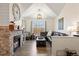 Cozy living room featuring a fireplace with stone accents and vaulted ceilings at 12762 Ironstone Way # 302, Parker, CO 80134