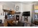 Inviting living room featuring a cozy fireplace, modern decor, and an open layout to the kitchen at 12762 Ironstone Way # 302, Parker, CO 80134
