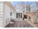 Inviting back patio with stone pavers, seating, and string lights, creating a relaxing outdoor space at 1360 S Hudson St, Denver, CO 80222