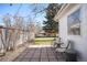 Inviting backyard patio with chairs, string lights, and a well-maintained lawn at 1360 S Hudson St, Denver, CO 80222