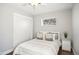 Comfortable bedroom featuring hardwood floors, a closet, and ample natural light at 1360 S Hudson St, Denver, CO 80222