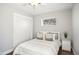 Bedroom featuring hardwood floors, closet with sliding doors, neutral walls, and a ceiling fan at 1360 S Hudson St, Denver, CO 80222