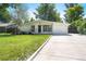 Traditional single-story home features a clean and modern design with a long driveway at 1360 S Hudson St, Denver, CO 80222