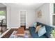 Stylish living room area with hardwood floors, a comfortable blue sofa, and modern decor at 1360 S Hudson St, Denver, CO 80222