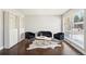 Bright living room with hardwood floors, a large window, and chic contemporary furnishings at 1360 S Hudson St, Denver, CO 80222