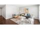 Cozy living room featuring neutral colors, hardwood floors, stylish decor, and natural light at 1360 S Hudson St, Denver, CO 80222