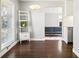 Bright living room flowing into kitchen, featuring hardwood floors, and modern decor at 1360 S Hudson St, Denver, CO 80222