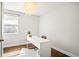 Bright home office features modern desk, hardwood floors, and stylish light fixture at 1360 S Hudson St, Denver, CO 80222