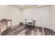 Bright basement room featuring modern vinyl floors, a sewing machine, and a closet at 5221 E 143Rd Dr, Thornton, CO 80602