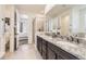 Bathroom featuring a large vanity with double sinks, a walk-in shower, and natural light at 5221 E 143Rd Dr, Thornton, CO 80602