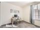 Bright bedroom featuring a work station, neutral walls, large window, and plush carpeting at 5221 E 143Rd Dr, Thornton, CO 80602