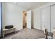 Bright bedroom with neutral walls, plush carpeting, a double door closet, and white trim at 5221 E 143Rd Dr, Thornton, CO 80602