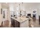 Open concept kitchen with granite countertops and a seamless flow to the living area at 5221 E 143Rd Dr, Thornton, CO 80602