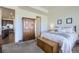 Bright main bedroom with a walk-in closet and ensuite bathroom at 5221 E 143Rd Dr, Thornton, CO 80602