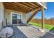 Ground floor patio with gravel, chairs, grill and stairs leading to a upper level at 5221 E 143Rd Dr, Thornton, CO 80602