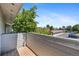 This balcony offers a private outdoor space overlooking lush greenery and parking at 10150 E Virginia Ave # 11-202, Denver, CO 80247