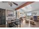 Bright living room featuring a skylight, wood beam, and hardwood floors at 10150 E Virginia Ave # 11-202, Denver, CO 80247