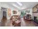 Cozy living room featuring vaulted ceilings, a skylight, and a brick fireplace at 10150 E Virginia Ave # 11-202, Denver, CO 80247