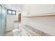 This bathroom features granite counters, white cabinets, and glass enclosed shower at 7076 S Verbena Cir, Centennial, CO 80112