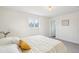 Bright, modern bedroom featuring neutral tones and a view from the bedroom window at 7076 S Verbena Cir, Centennial, CO 80112