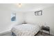 This bright bedroom has crisp white walls and a window letting in natural light at 7076 S Verbena Cir, Centennial, CO 80112