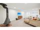 The light and airy living room has a vintage fireplace and plush seating at 7076 S Verbena Cir, Centennial, CO 80112