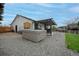 Backyard featuring a hot tub, patio with pergola, and gravel landscaping at 9664 W Grand Ave, Littleton, CO 80123