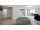 Finished basement area featuring new carpet, a beanbag chair, and ample living space at 9664 W Grand Ave, Littleton, CO 80123
