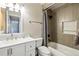 Neutrally-toned bathroom features a shower and modern white sink vanity at 9664 W Grand Ave, Littleton, CO 80123
