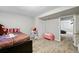 ' bedroom area with toys, a bed, and door to the basement at 9664 W Grand Ave, Littleton, CO 80123