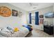 Bright bedroom with window view, carpet, and decorations at 9664 W Grand Ave, Littleton, CO 80123
