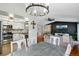 Open-concept living space showcasing the kitchen, dining room, and living room at 9664 W Grand Ave, Littleton, CO 80123