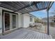 Outdoor patio with a pergola, comfortable seating, and adjacent garden space at 9664 W Grand Ave, Littleton, CO 80123