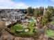 Stunning aerial view of the property showcasing the pool, putting green, fire pit, and lush landscaping at 2 Sterling Ave, Cherry Hills Village, CO 80113