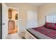 Bedroom with a walk-in closet and adjacent laundry room at 9470 Loggia St # D, Highlands Ranch, CO 80126